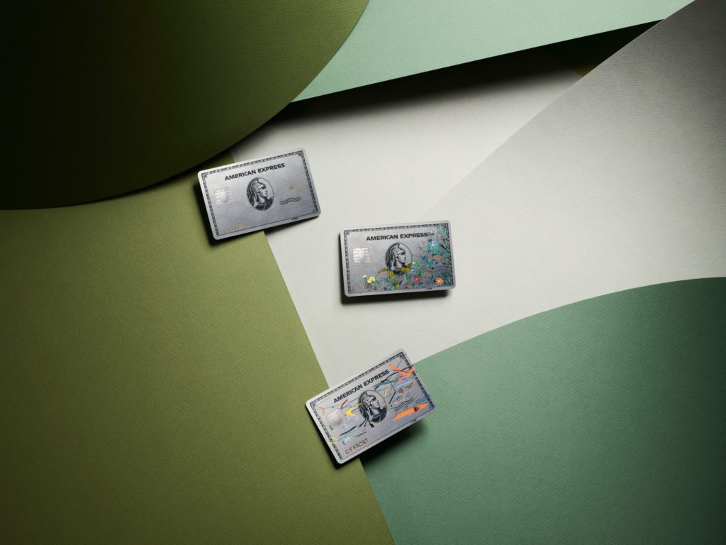 a group of credit cards on a green and white background