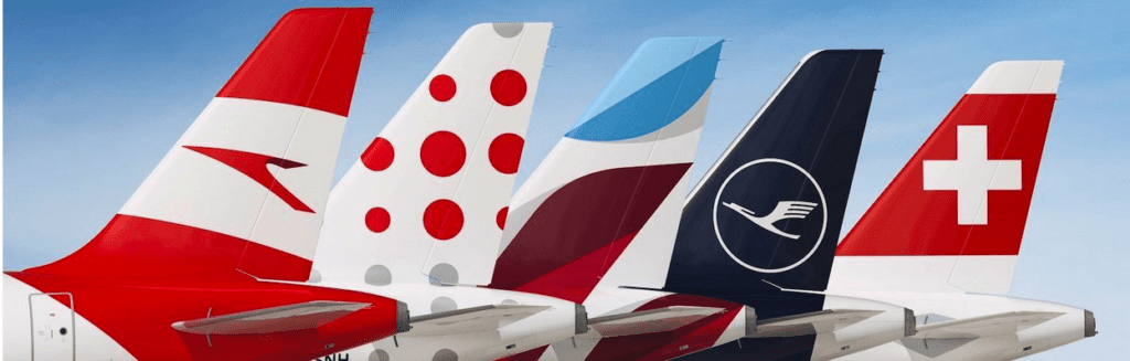 tail fin of a plane with a red white and blue design