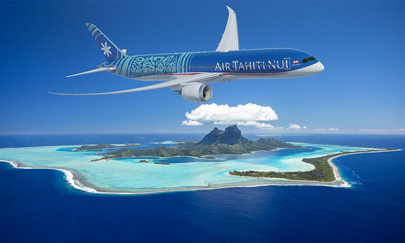 an airplane flying over an island