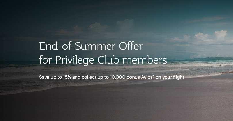 a beach with waves and clouds