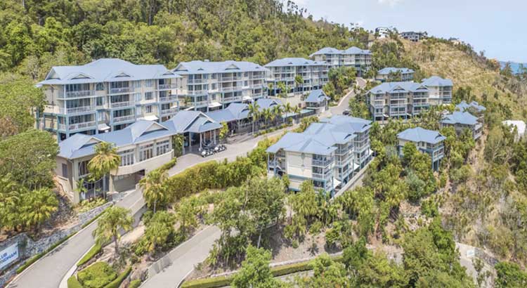 a group of buildings with trees