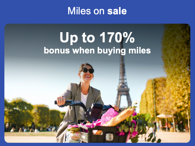 a woman riding a bicycle with a basket of food