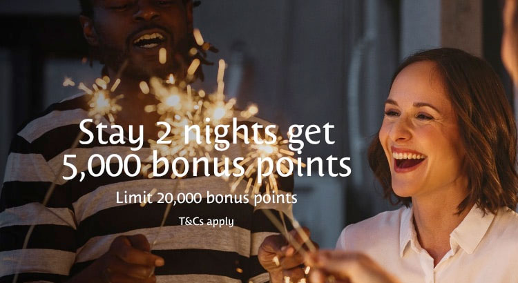 a group of people holding sparklers