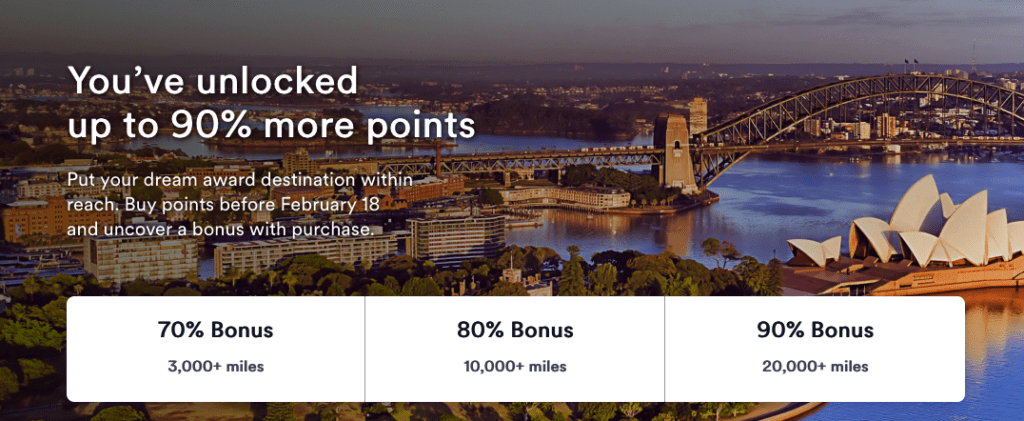 a bridge over water with trees and buildings