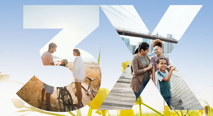 a group of people standing on a beach